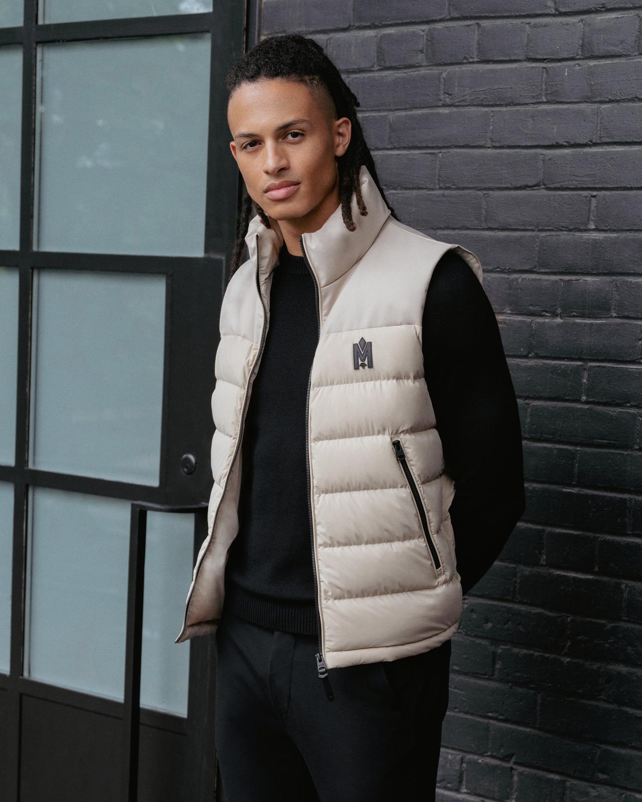 male model outside wearing Mackage puffer vest