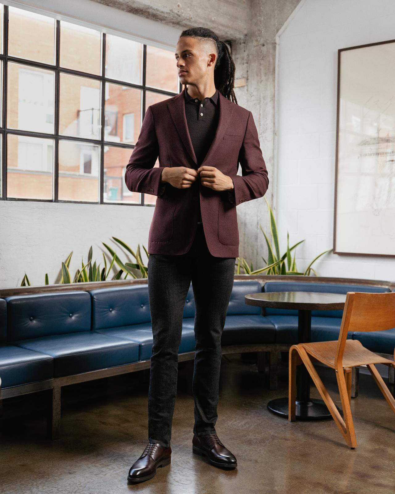 male model in coffee shop wearing suit