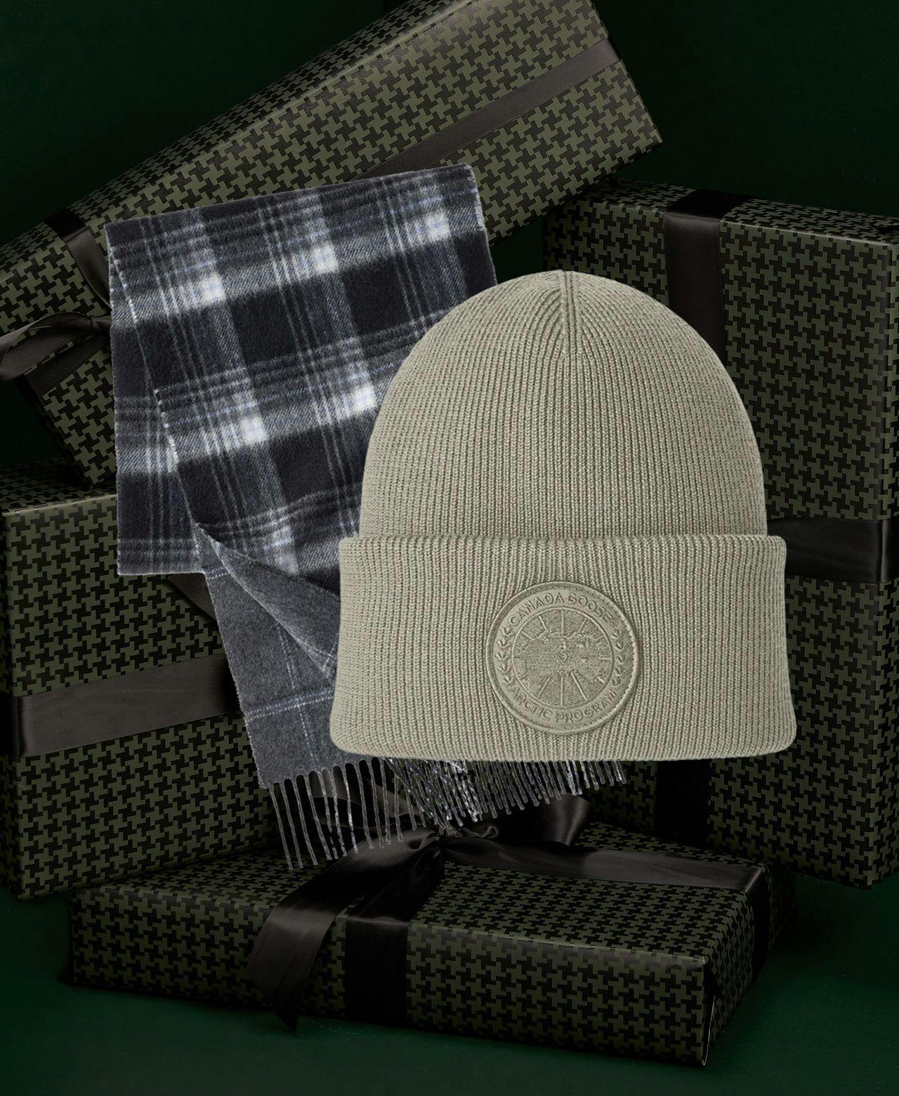 Canada Goose Beige Merino Wool Toque & checkered scarf on dark green gift boxes backdrop