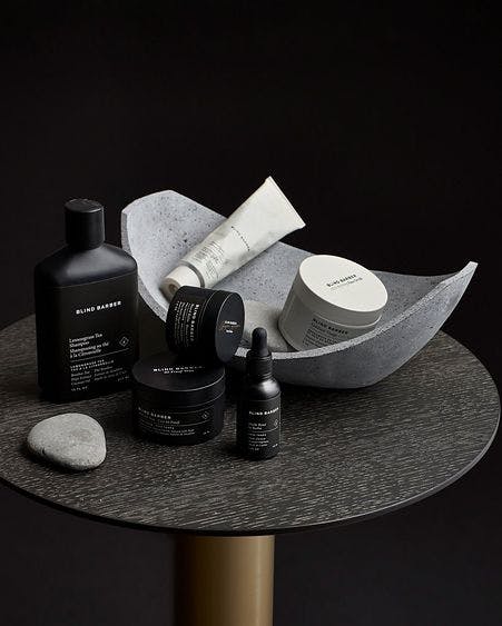 blind barber products ontop of table in bowl and on table top