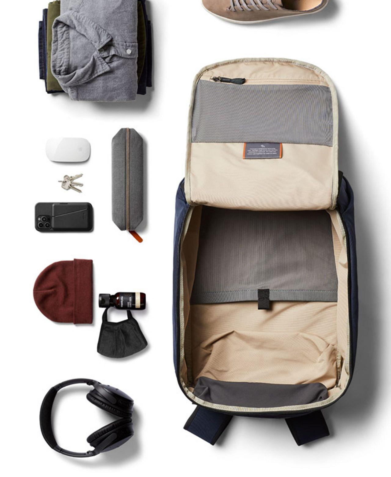 Bellroay bag opened and travel essential items displayed around it