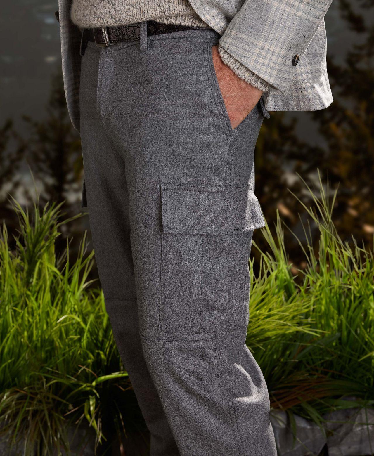 male model torso wearing trousers posing with one hand in pocket