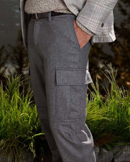 male model torso wearing trousers posing with one hand in pocket