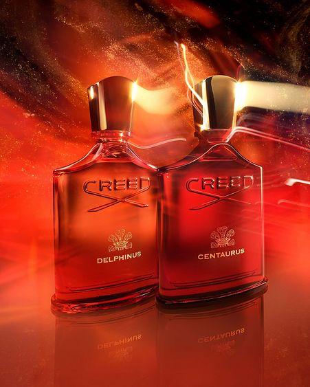 two Creed perfume bottles