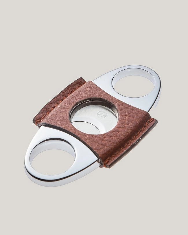 Metal cigar cutter with leather accents