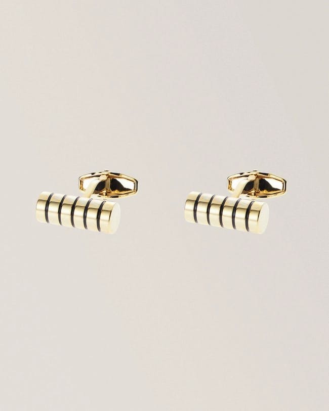 Two gold cufflinks with black stripes on them
